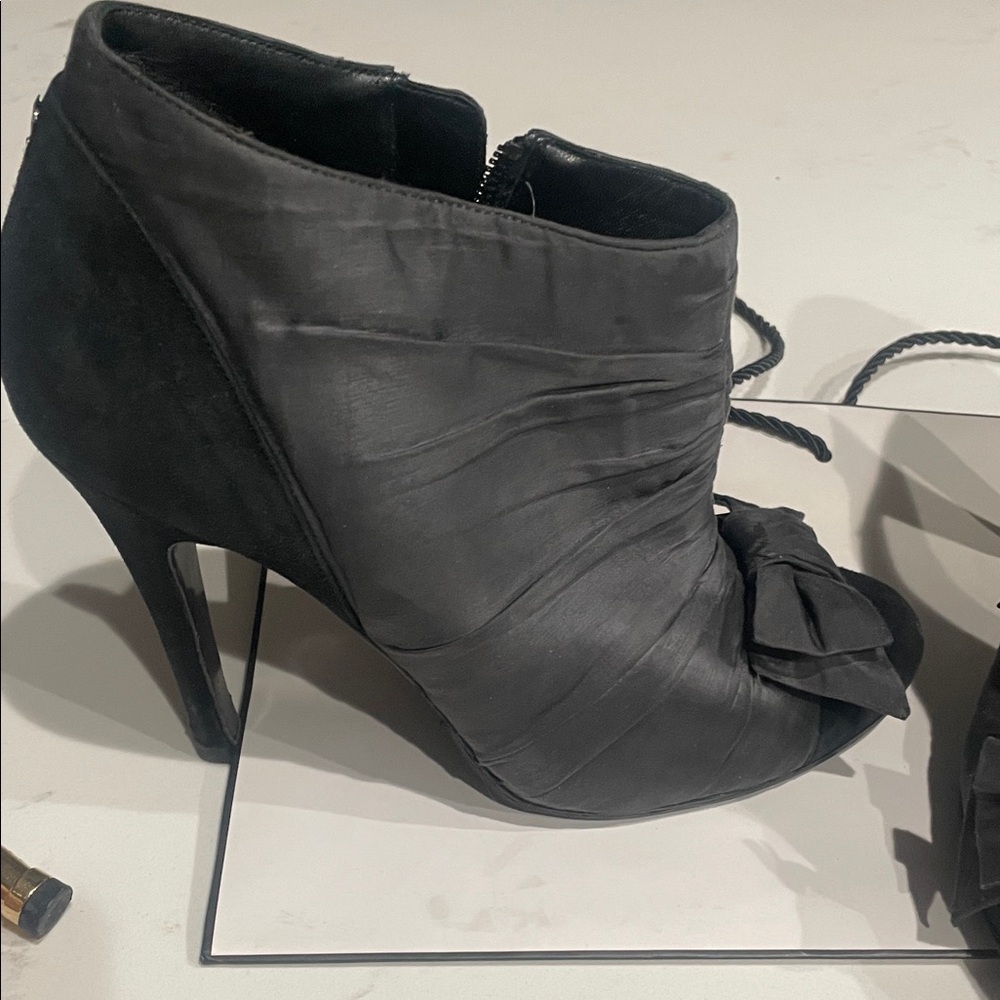 CHANEL Black Heeled Boots with Bow Accent - Picture 2 of 9